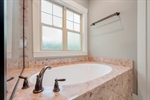 Large relaxing soaking tub.