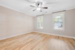 Striking flooring and lighted ceiling fan.