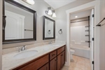 Second full bath. Double vanity. Shower over tub.