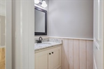 Main level powder room for your guests.