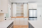 Abundant cabinetry with custom built-ins.