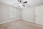 Walk-in closet and lighted fan.