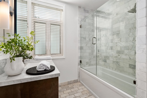 447 N. Doheny Drive #102  Guest Bathroom Marble Floors Counters  Shower - La Terrasse Beverly Hills Condo For Sale