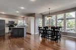 Beautiful hardwoods flow into the eat in kitchen.