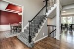 Ascend the stairs to the bedroom level.