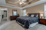 Multi tiered ceiling with refreshing lighted fan.