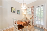 Dining area with door leading to the backyard.