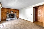 Family Rm has fireplace wood mantel+accent wall
