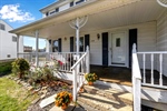 Covered porch~front deck stairs~ front door
