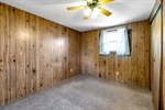 13x11 BD has panelled walls ceiling fan + closet