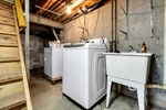 Laundry area with washer dryer + stationary tub