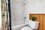 Full Ba: Tub with surround~wainscoting on walls