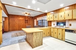 Kitchen has 2 tiered counter~breakfast bar