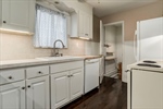 White cabinetry and appliances.