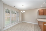Spacious dining area adjacent to kitchen.