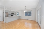 Dining area connected to kitchen and living room.