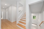 Large light-filled stairs down to lower level.