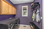 Main level laundry room off of foyer and garage