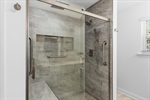 Tile and glass shower with bench seat