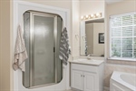 Separate shower and dual vanities.