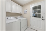 Separate laundry with included washer and dryer.