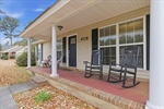 Be greeted by a delightful covered front porch.