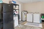 Laundry is located off the kitchen in the garage.
