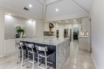 Sleek Kitchen has over-sized waterfall island