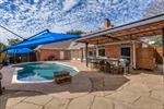 Pool Area has pergola-covered Outdoor Kitchen