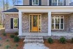 Be greeted by a covered front porch.