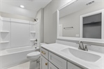Third bedroom ensuite with a shower over tub.