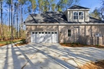Side entry garage and brick service yard.