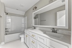 Third full bath with double vanity.