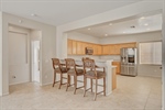 6824-Woodland-Vase-Ct-MLS_20 1-kitchen with stools