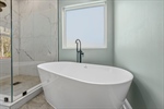 Free standing soaking tub.