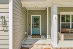 Be greeted by a delightful covered front porch.