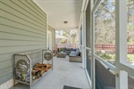 Screened porch with backyard views.