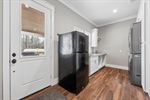 Spacious laundry room with carport access