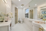 Hallway Bath with door to Primary Suite
