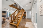 Ascend the stairs to the bonus or 4th bedroom.
