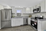 Bright kitchen with new stainless appliances