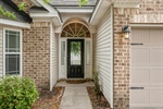 Be greeted by a delightful covered front porch.
