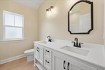 Second full bath with double vanity.