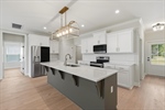 Fully equipped kitchen with stainless appliances.