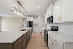 Abundant and gorgeous real wood cabinetry.