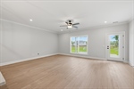 Spacious great room with door to the backyard.