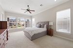 Primary suite with lake and backyard view