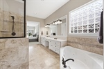 Double-door entry to elegant bath