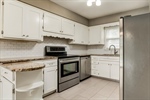 Granite counters and full tile backsplash.