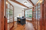 Off the foyer through French doors is the office.